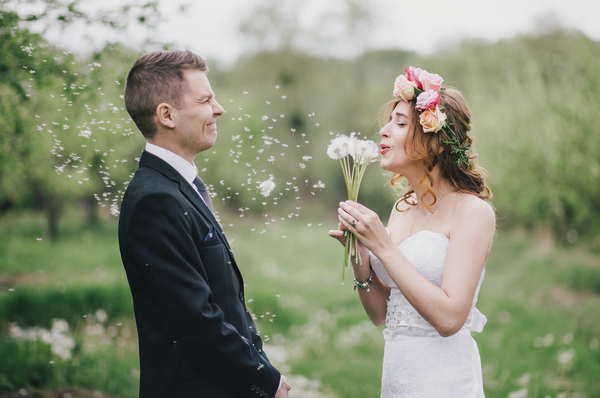 Playful Bride and Groom Tease each other on wedding day