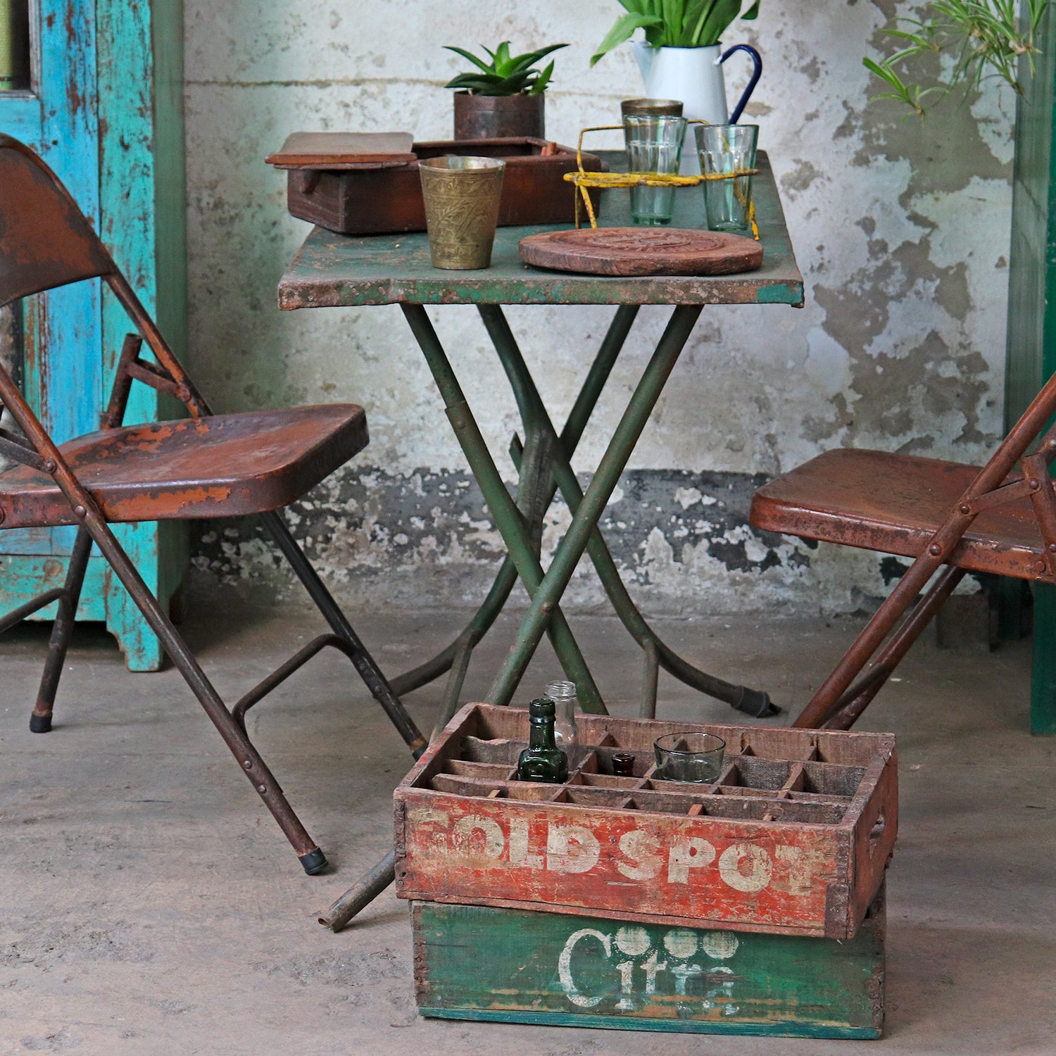 Use vintage wooden crates for unique and colourful storage in your home