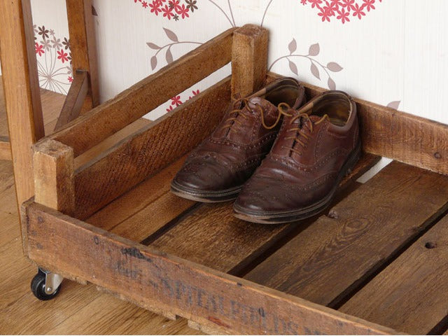 Vintage apple crates as shoe storage