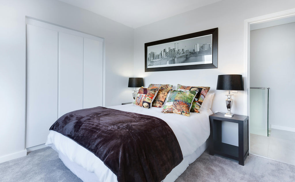 Modern Bedroom with Large Bed and White Finishes