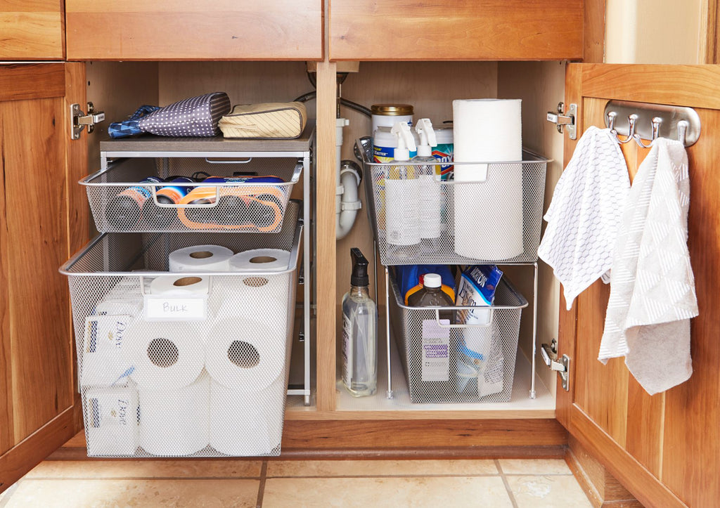 Cleaning supplies and bathroom products under the sink cabinet