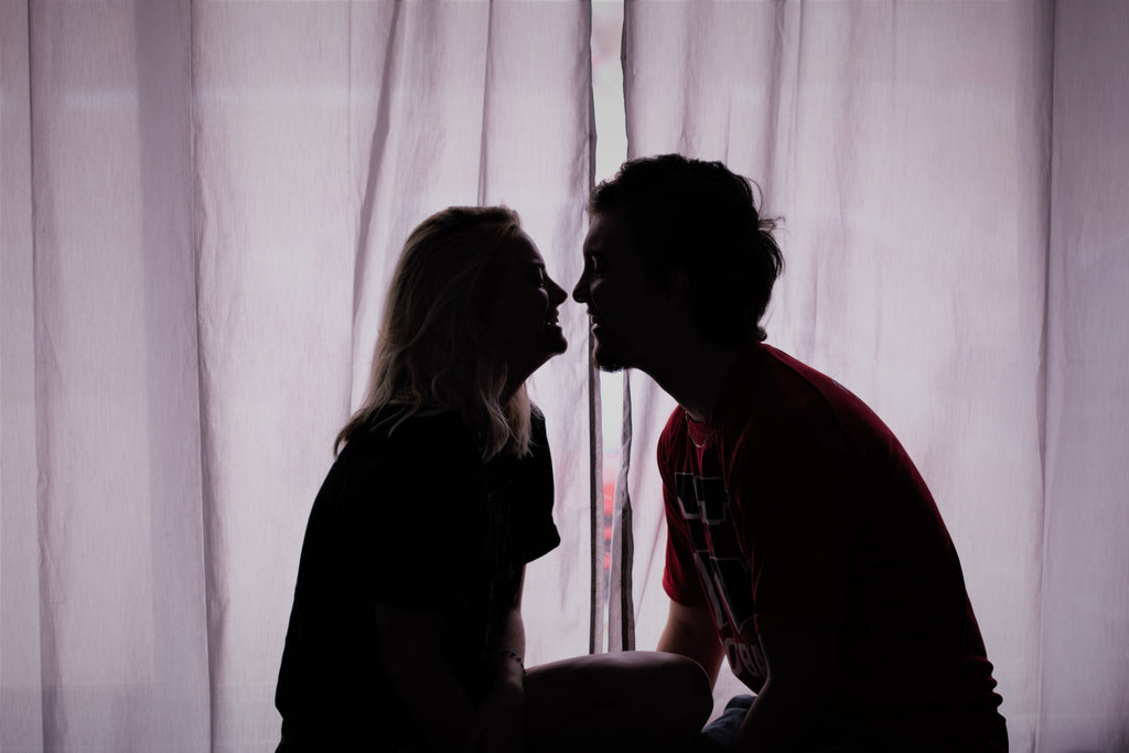 Man and Woman Kissing in Dark