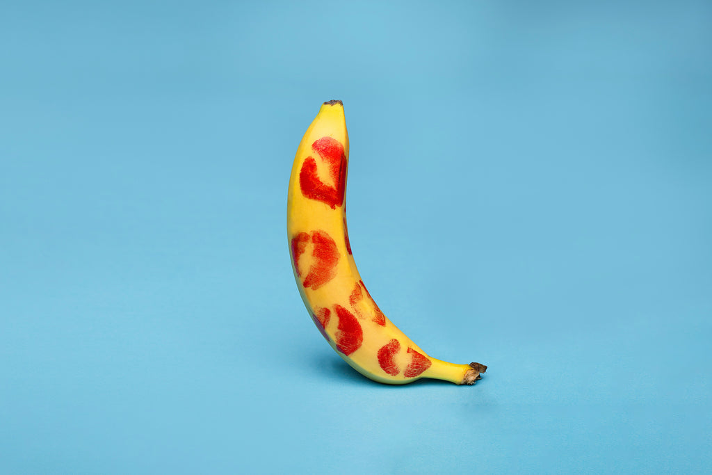 Banana with Kisses on Blue Background