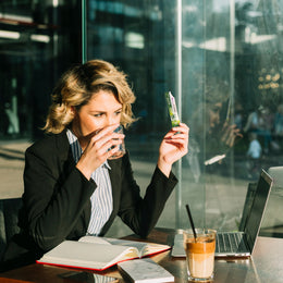 businesswoman-drinking-water-with-laptop-chocolate-milkshake-desk edited.jpg__PID:cb941f89-7e2a-4622-bdc7-97db9afe0e4d