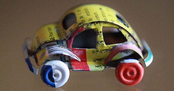 An automobile kid toy made of upcycled and recycled materials
