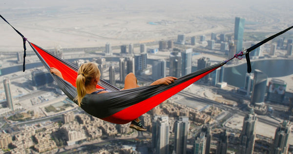 A girl in a hammock on top of Dubai