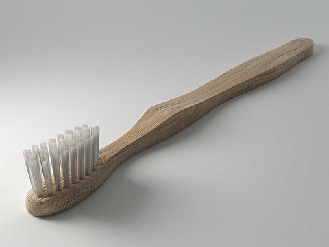 A Studio Shot Of A Bamboo Toothbrush