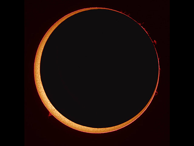 Since the Moon appears smaller than the Sun during an annular solar eclipse, the Sun peeks out from around the Moon. Credits: Stefan Seip