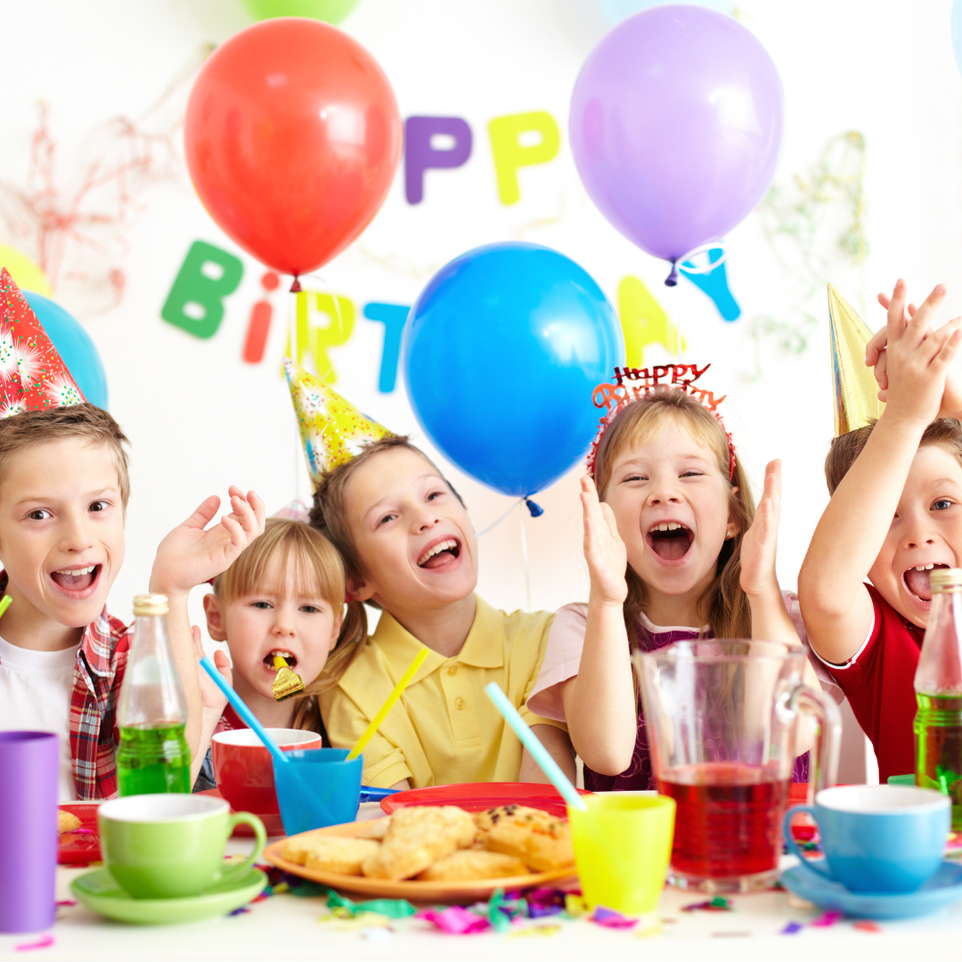 Young child celebrating birthday with friends.