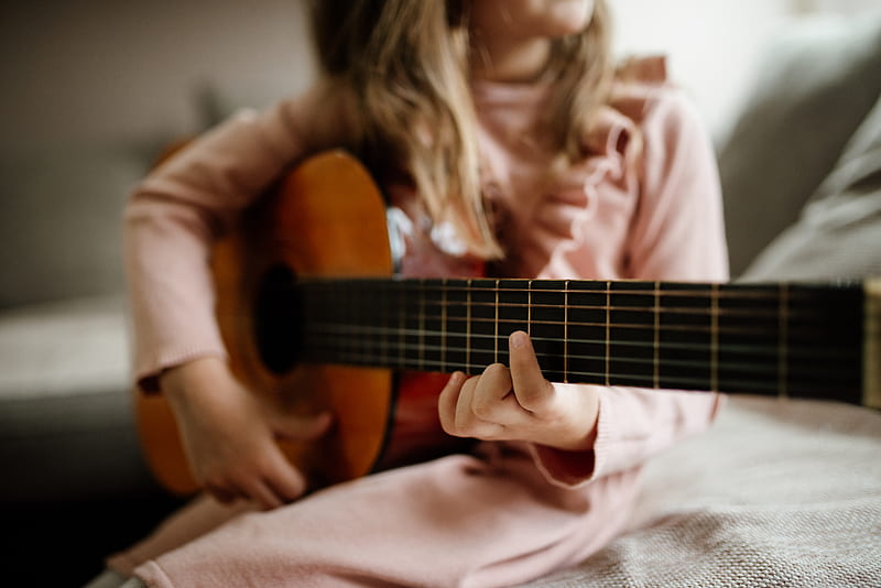 A girl playing guitar.