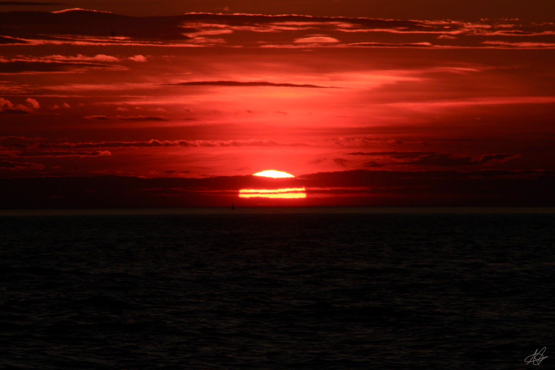 Beautiful Glowing Sunset Over Ocean Setting Slowly