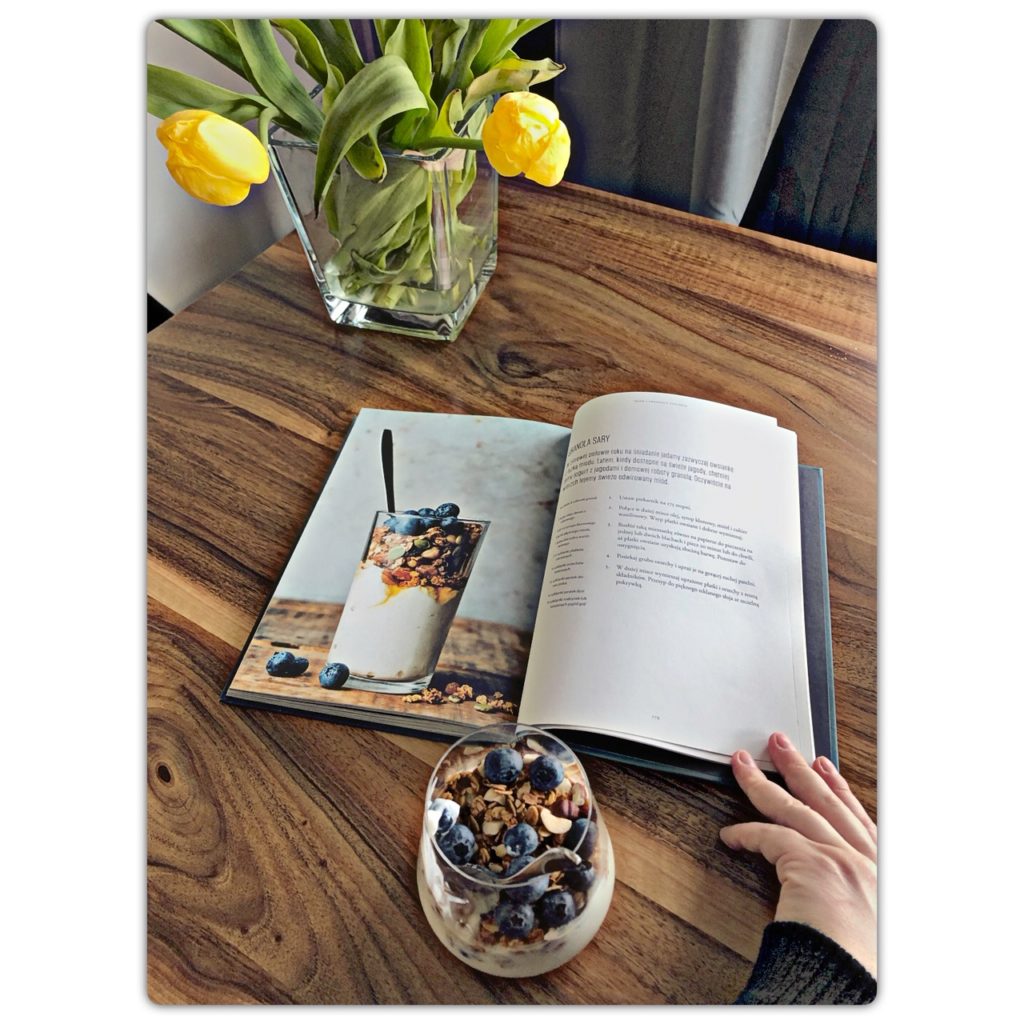 A book with a recipe for granola with heather honey and blueberries.