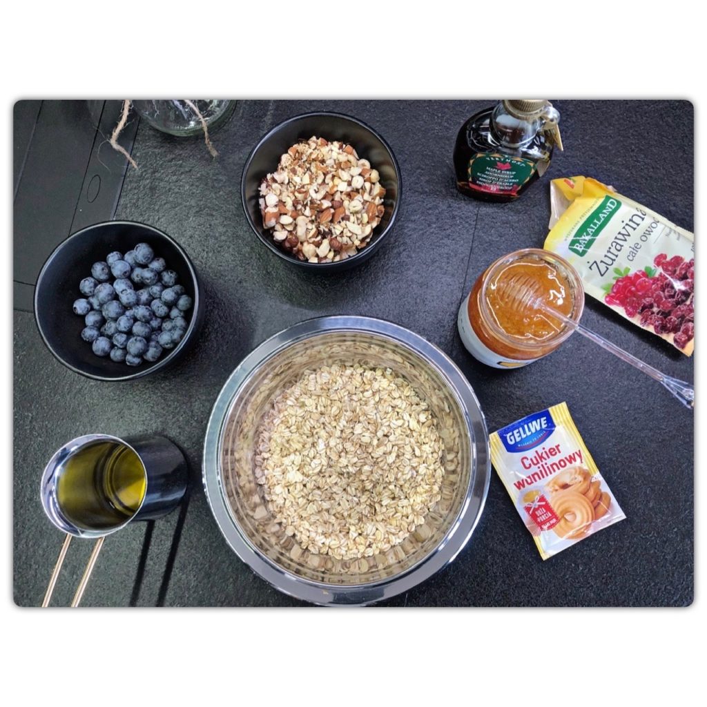 Ingredients for granola with heather honey and blueberries: nuts, meat, colony syrup, oil, honey