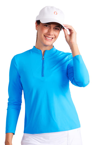 A woman wearing a long sleeve pickleball shirt