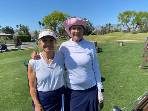 Dianne (founder of KINONA) and Patty playing golf together