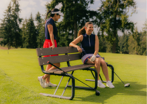 Two women chatting on the golf course