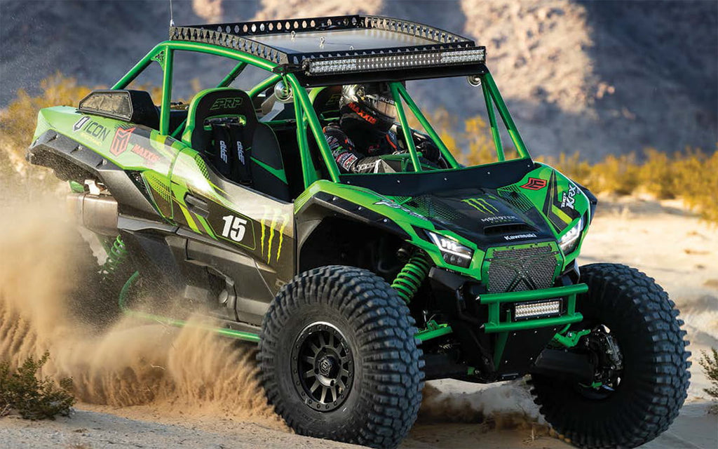 Kawasaki side by side racing in sand with Maxxis Roxxzilla high performance sticky tires.