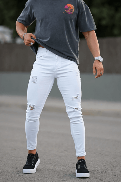 Male model wearing our Vittorio Denim Jeans in white, this is a pair of one of our denim collections at MICHELLO Michèllo