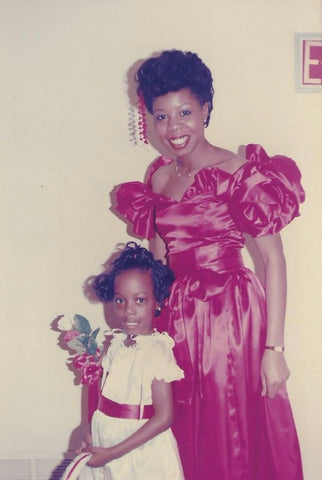 Margo and daughter Tiffany in red and white dresses.