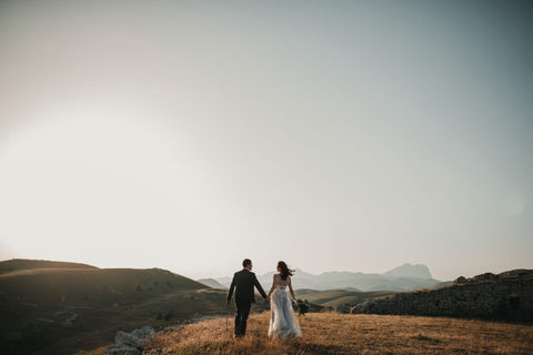 bride and groom in the middle of the mountain plain