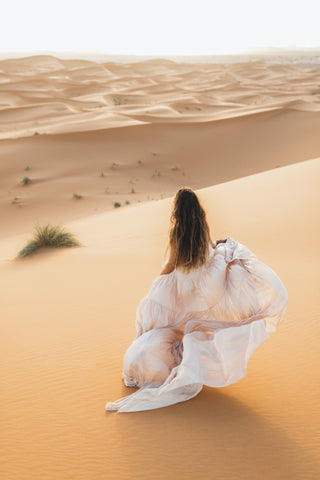 Flowing silk wedding gown on a bride