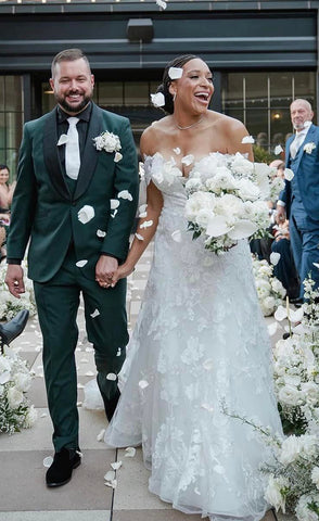Off shoulder sleeves wedding dress on a bride walking