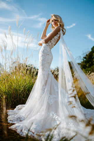 Lace mermaid gown on a pretty bride