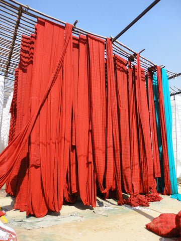 Dyed cloth hanging to dry in the sun—Beautiful!!