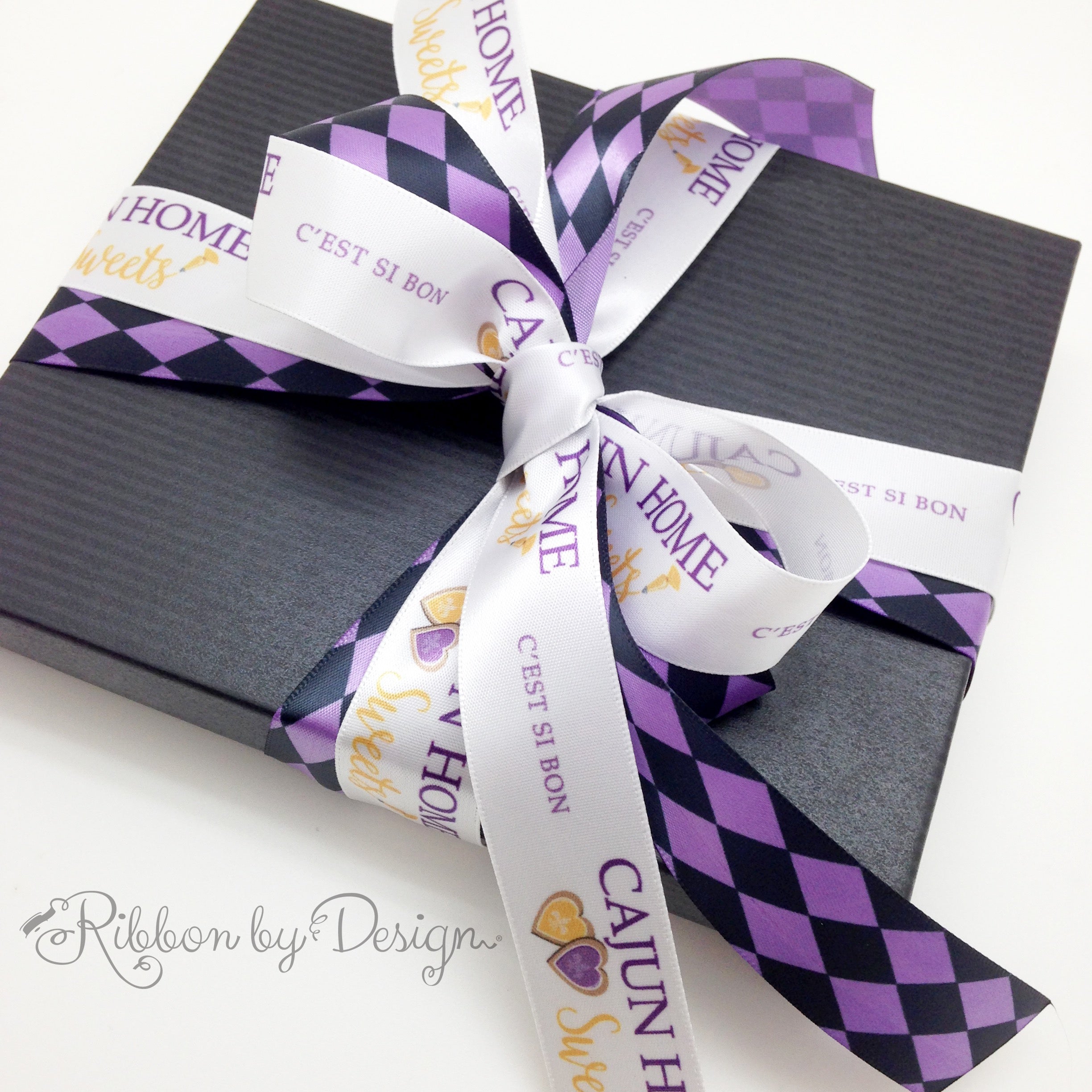 Cajun Home Sweets' packaging box with their custom ribbons