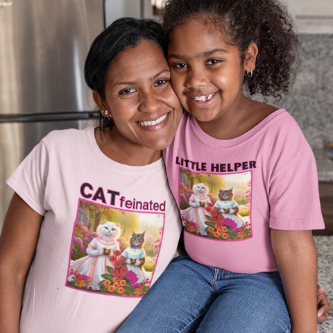 Flowers, Cat Clothing, Gifts, T-shirts. Mother hugging her daughter with mother wearing a cat in the flower garden t-shirt and daughter wearing a Little Helper cat in the flower garden t-shirt.