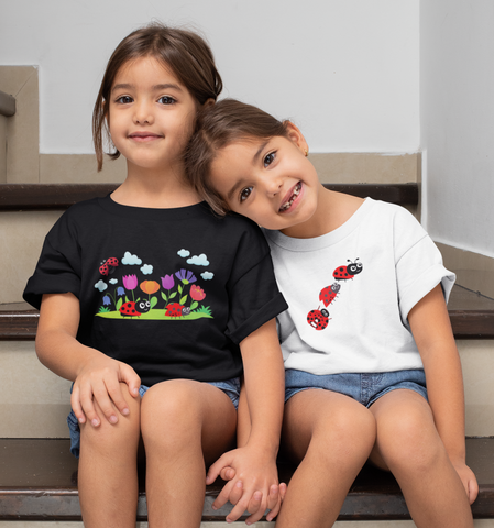 Flowers, Nature Clothing, T-shirts, Gifts. Twin girls sitting on a step wearing a flower t-shirt and ladybug t-shirt. Nature.