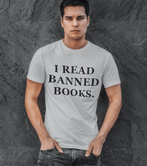 Handsome_man_leaning_against_a_wall_wearing_a_t-shirt_with_a_quote_I_read_banned_books.