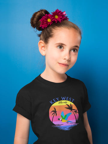 Places, location clothing, t-shirts, gifts. Little girl with braids wearing a black t-shirt with Key West, Florida location symbol.