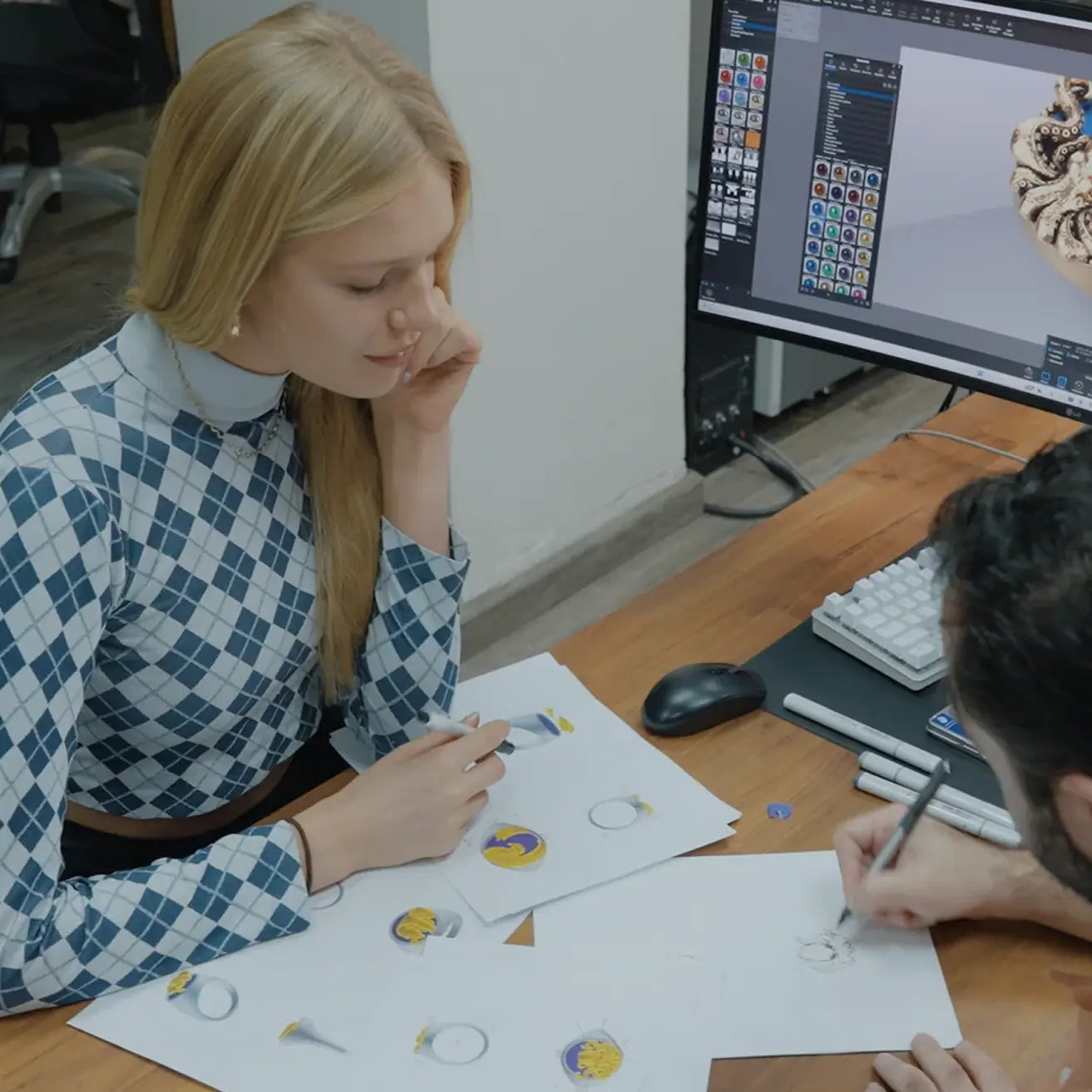 women designing jewelry with manufacturer