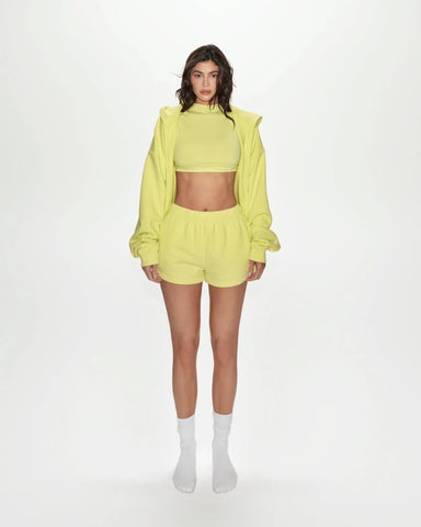 Spring outfit ideas featuring a yellow cropped hoodie set with matching shorts and socks for a casual look.
