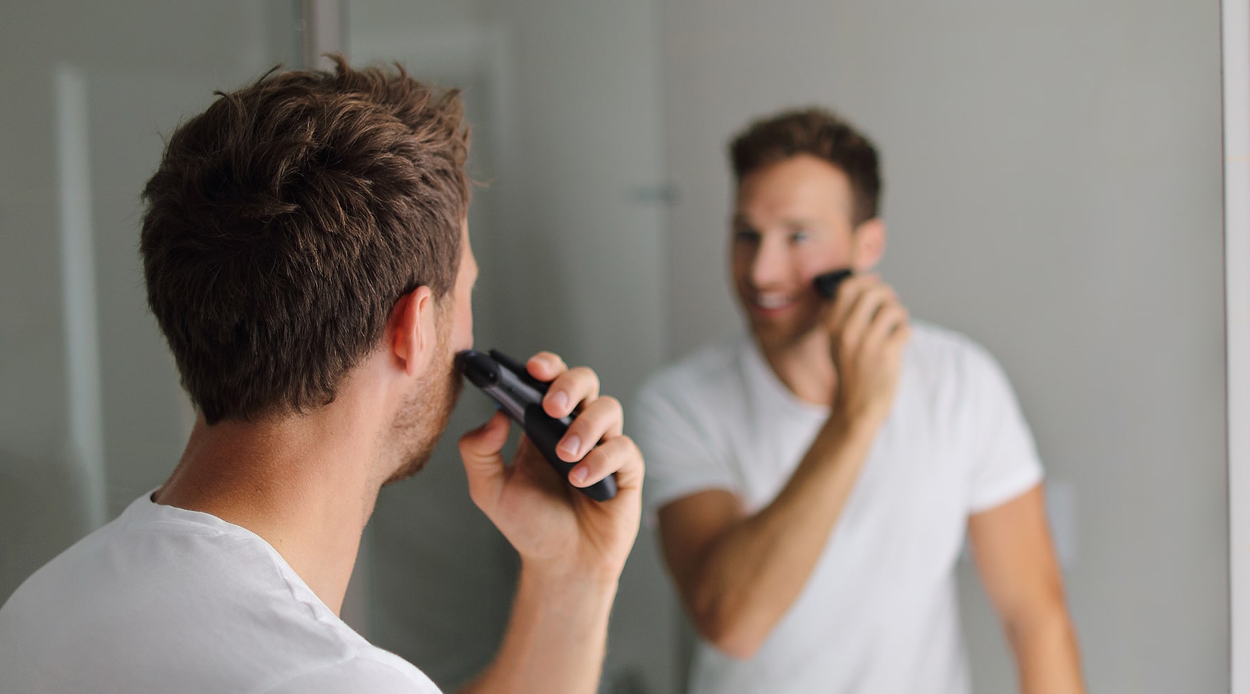 man-shaving-with-electric-shaver