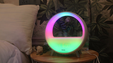 a smart light beside a bed