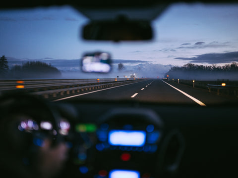 driver view of a highway at night