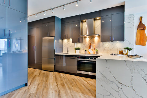 a white and black kitchen counter with smart lighting inside