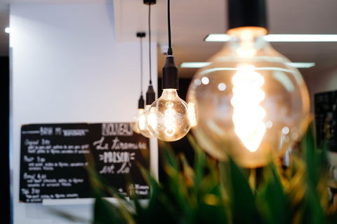 Glowing LED light bulbs in restaurant