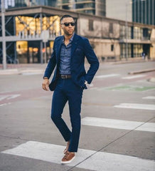 Man with short beard in a blue suit