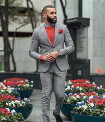 Black man in suit with red t shirt