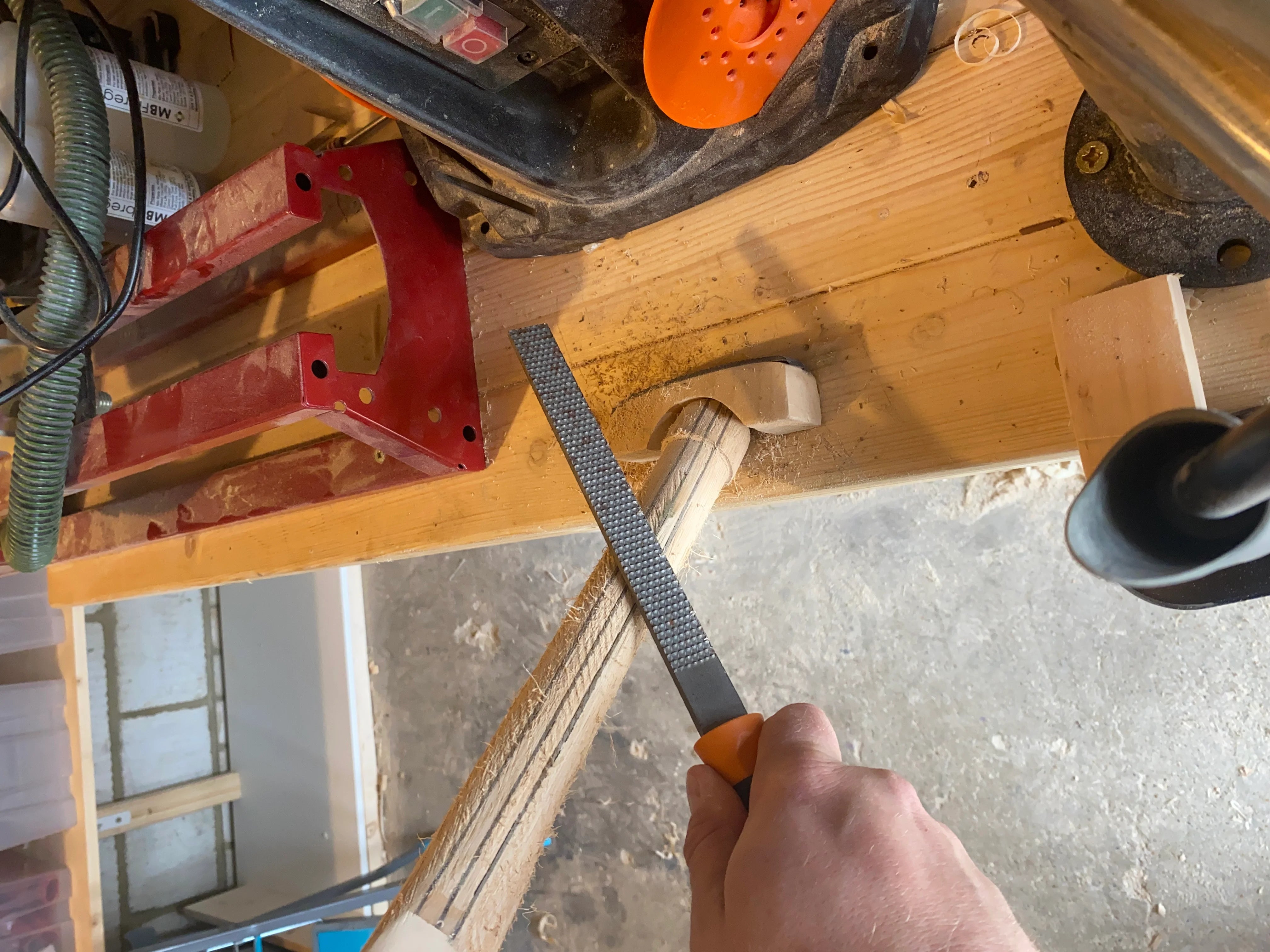rasping a cricket bat handle