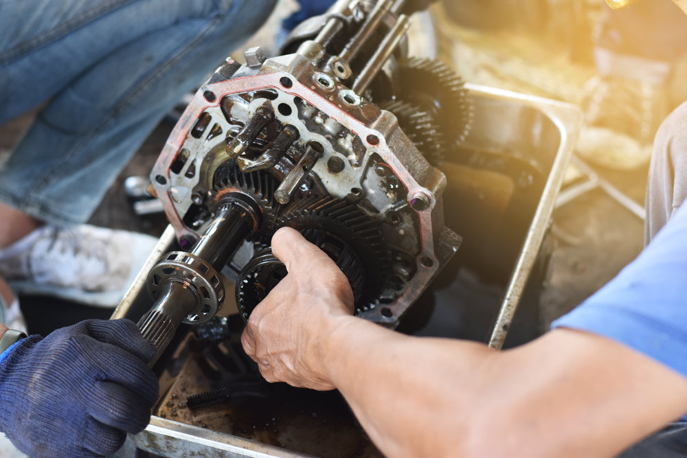 Two men fixing a custom gear