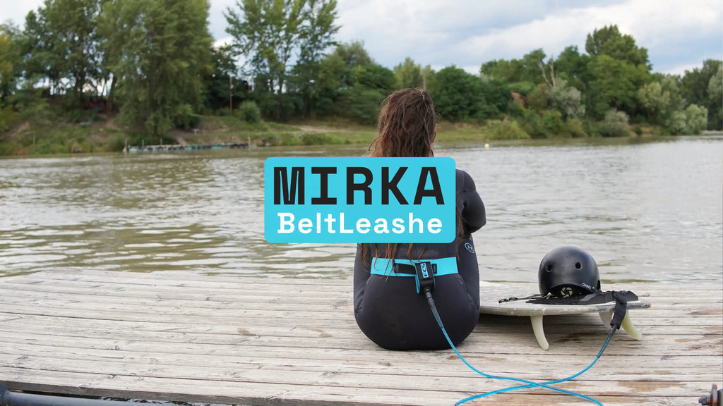 belt leash wild girl sits on the bank of Čunovo, riversurfing