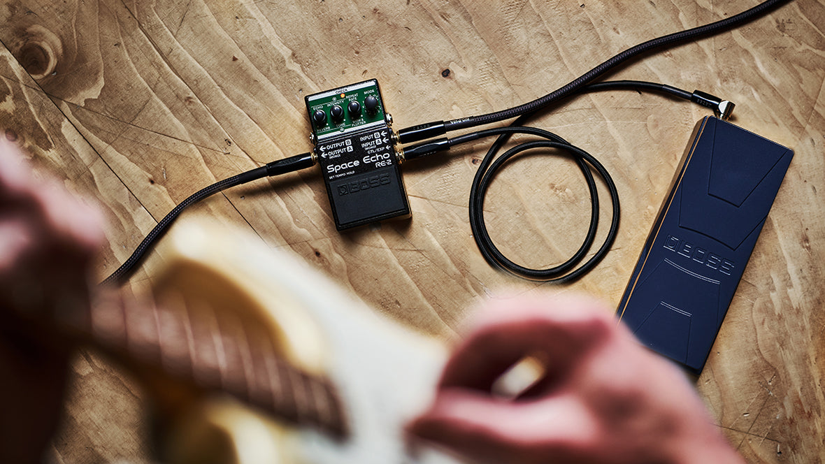 Guitarist using RE-2 with BOSS Expression pedal