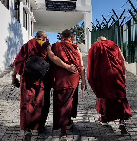 Geshe Kunga flanked by monk friends on the kora
