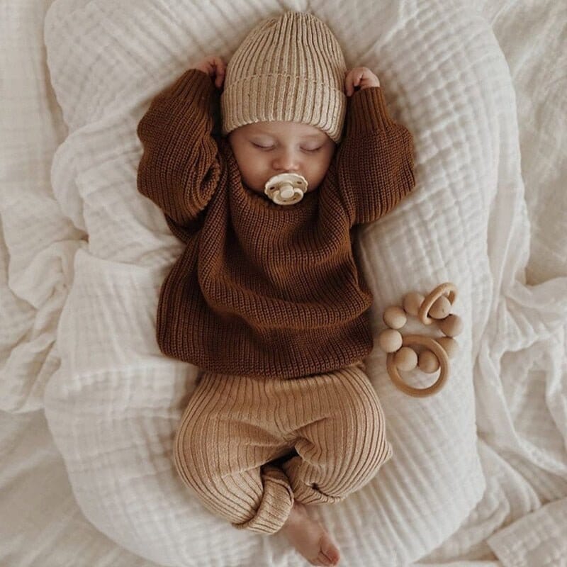 a sleeping baby with sleepwear