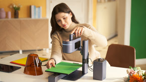 A woman aligns the paper card on the Slide Extension