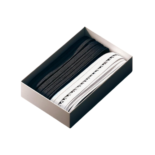 Black and white socks neatly arranged in a box.